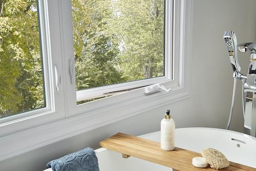 closeup of bathroom tub with casement window