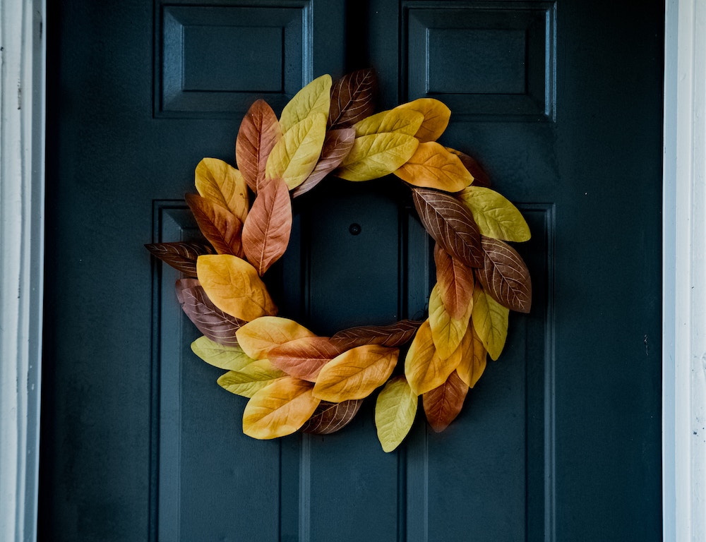 entry door with fall wreath