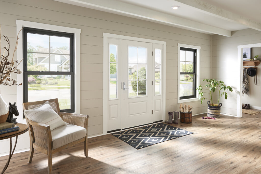 Black double hung windows in front entry way.